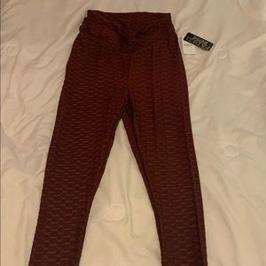Burgundy athletic leggings. Size Medium. From rue21.